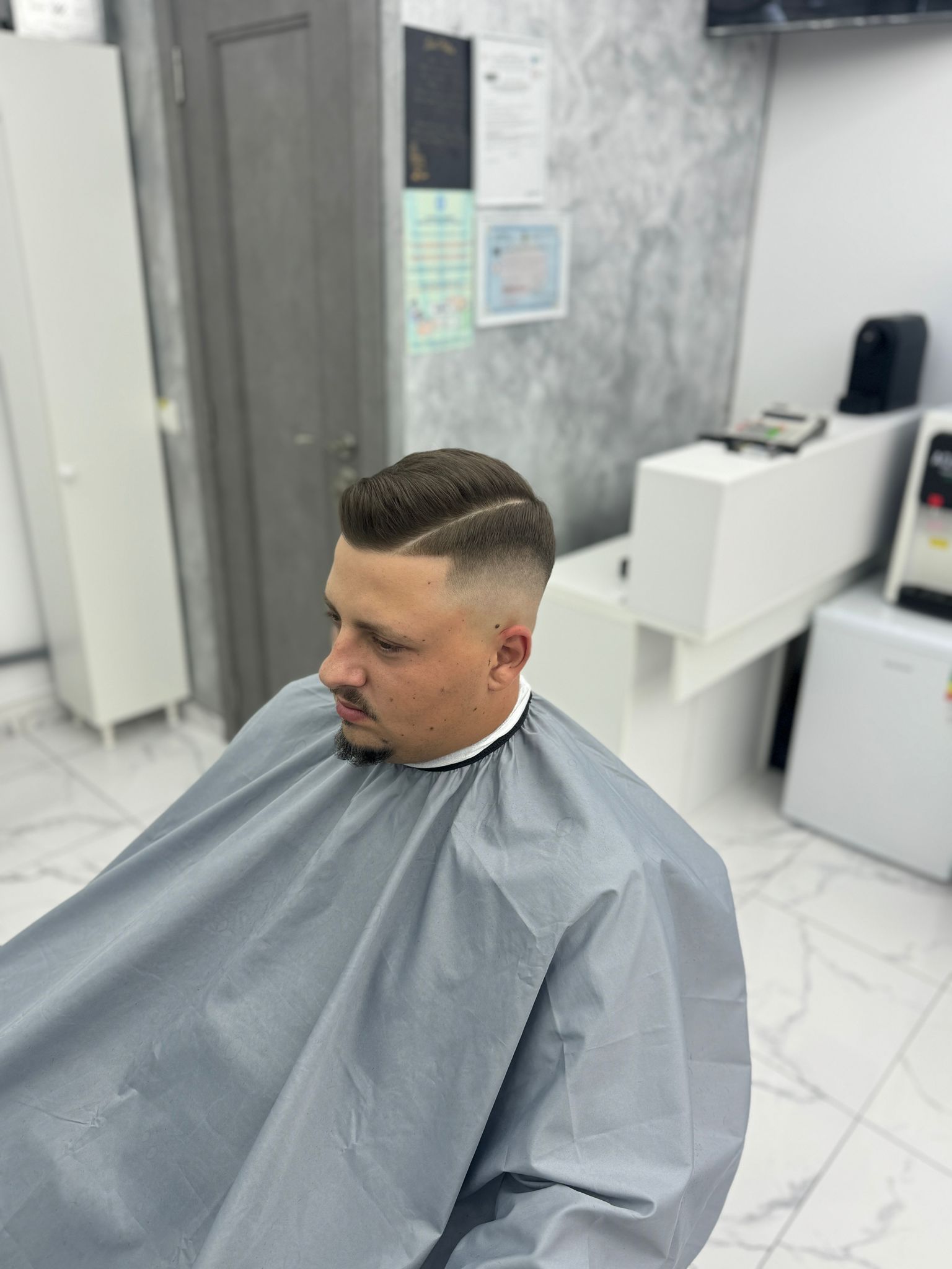 Skin fade with hard part